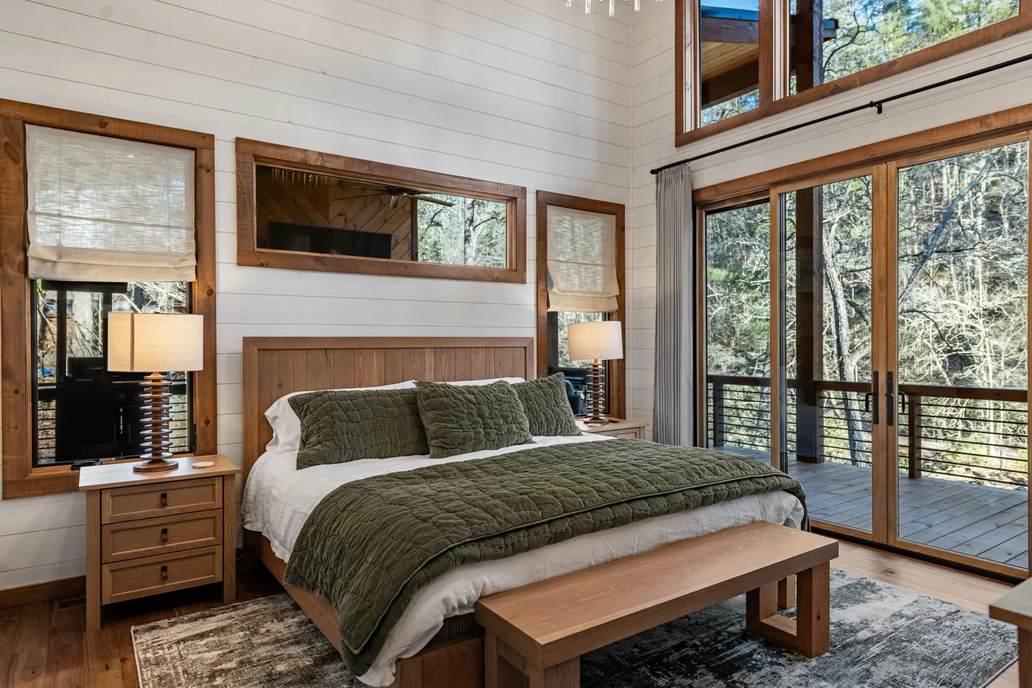 Master bedroom windows flooding the space with natural light.