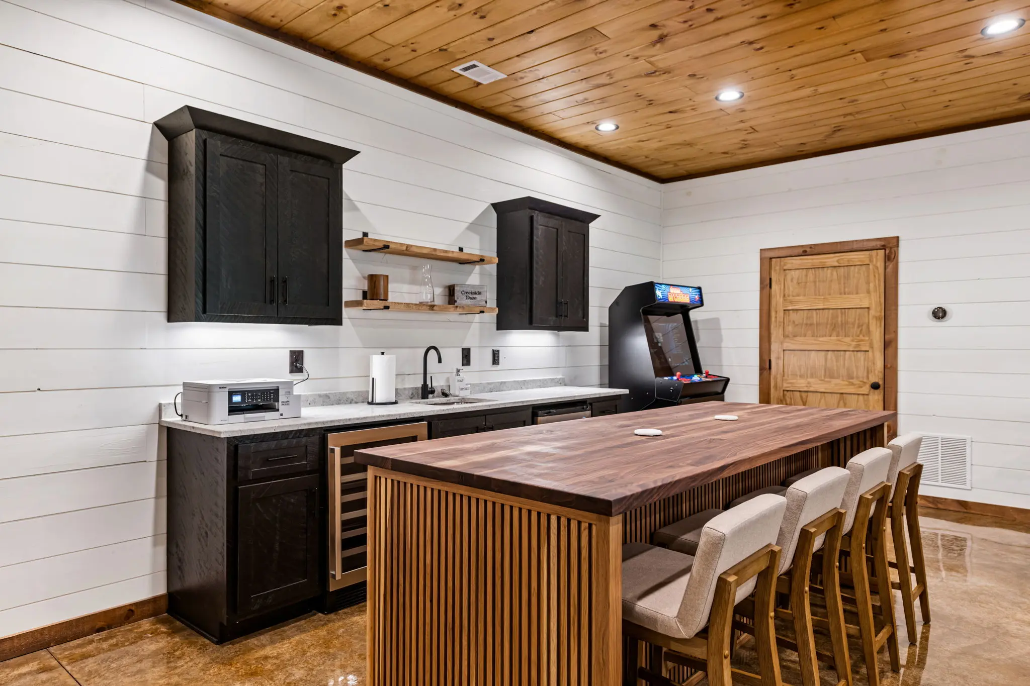 Lower level kitchen featuring modern appliances and generous counter space.