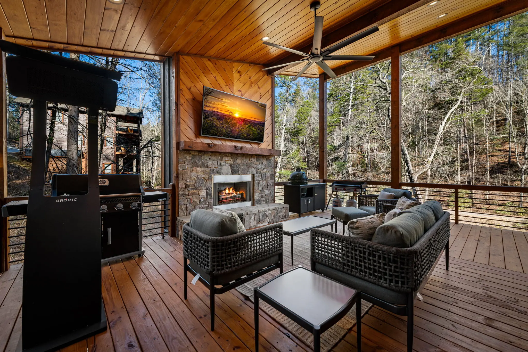 Upper balcony with a mix of deck furniture and amenities.
