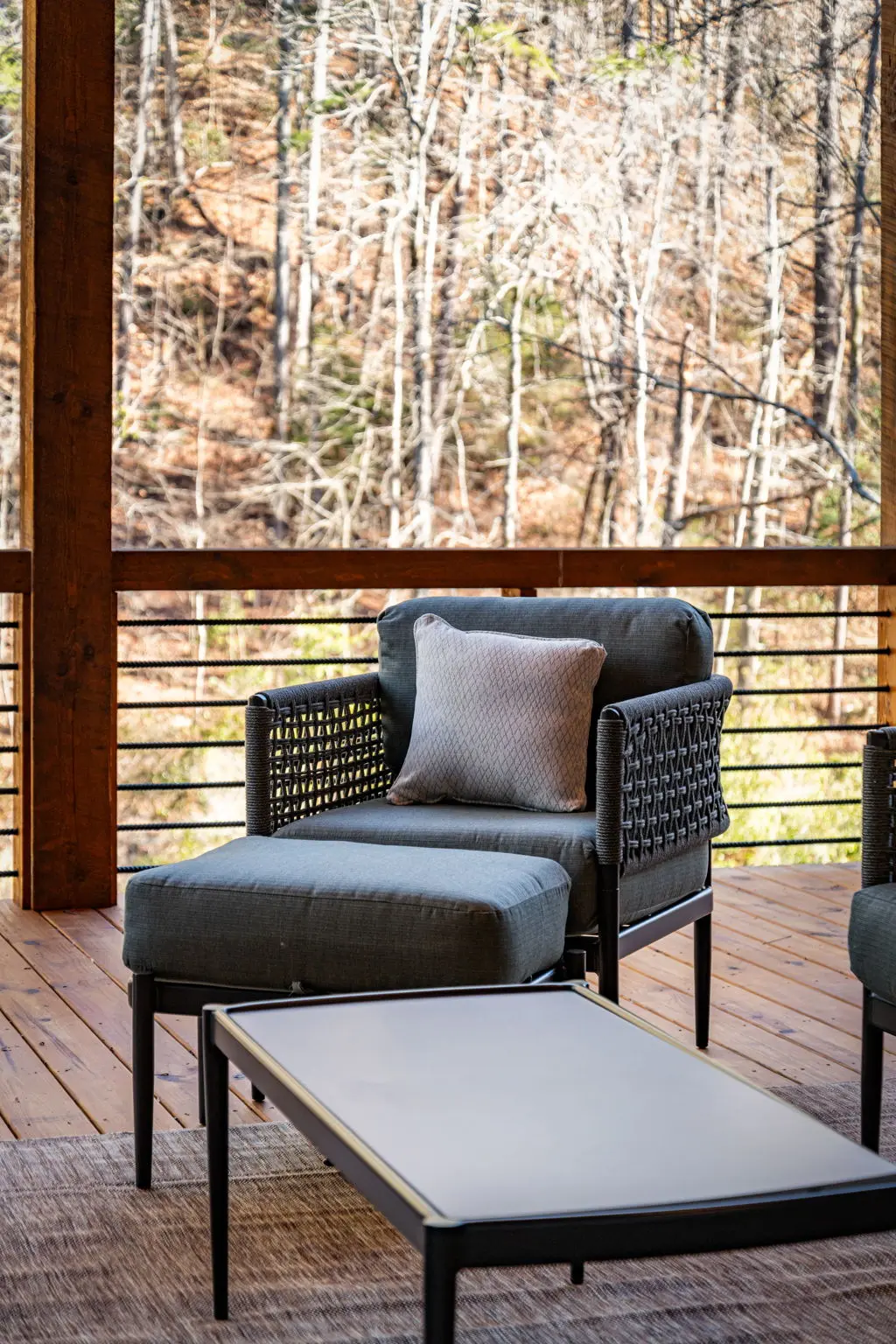 Upper balcony terrace with natural light and landscape beyond.