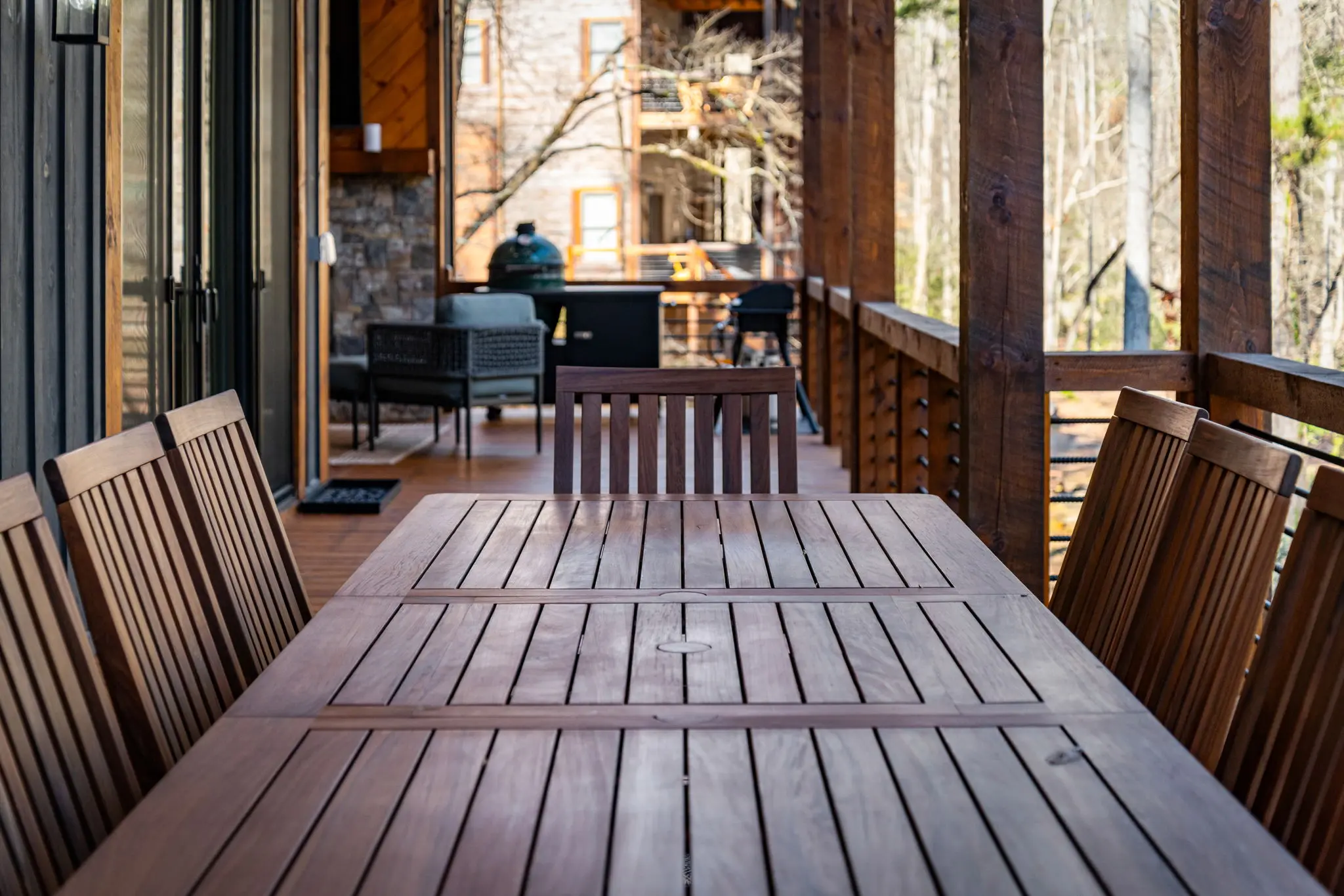 Upper balcony dining with a view of the surrounding landscape.